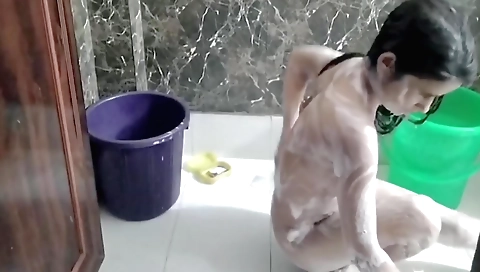 Indian naked girl in blue dress is alone in the house