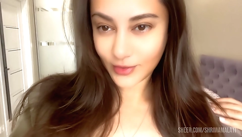 Solo female plays with her shaved pussy and face on camera