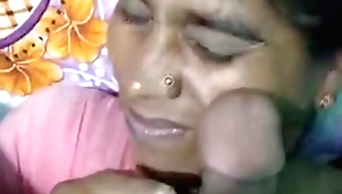 Indian brunette girl with a sexy mouth is giving a blowjob