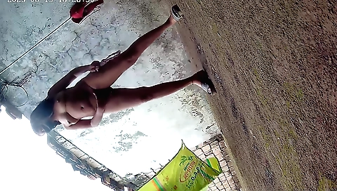 Indian girl in a black shirt and a nice skirt in a park