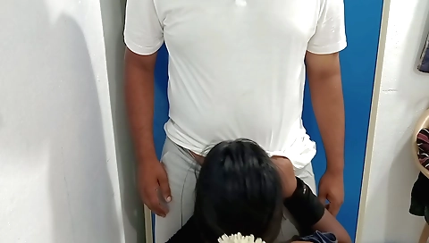 Brunette chick with a red dress gets on knees and fucks