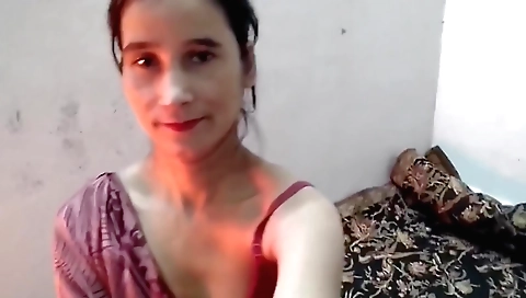 Indian woman is naked and has sex with a guy on camera