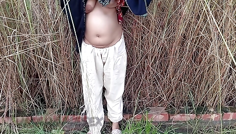 Indian housewife sucks his penis in open-air video