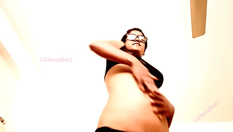 Indian amateur girl plays on the camera in a dancing pose