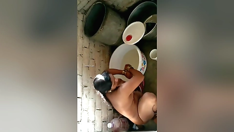 Indian amateur brunette in a bikini bathers in a shower