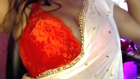 Horny brunette in a black bra and panties is masturbating