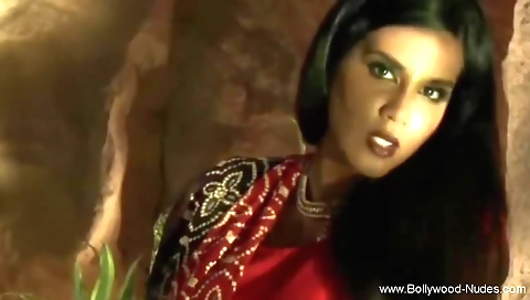 Indian brunette in a white dress with a sexy smile