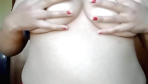Girl with beautiful face and round tits masturbating
