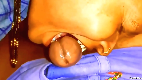 A big boobed indian is getting deep throated by a dick