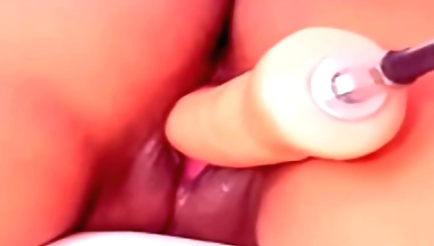 Solo female masturbates with a vibrator on her laptop