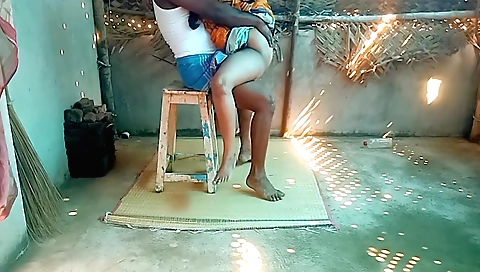 Indian girl in the village home cleaning her house