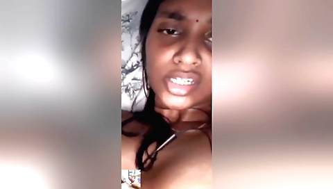 Hairy brunette in sexy dress fingering her hairy pussy